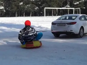 За катание на "ватрушке" за автомобилем грозит штраф